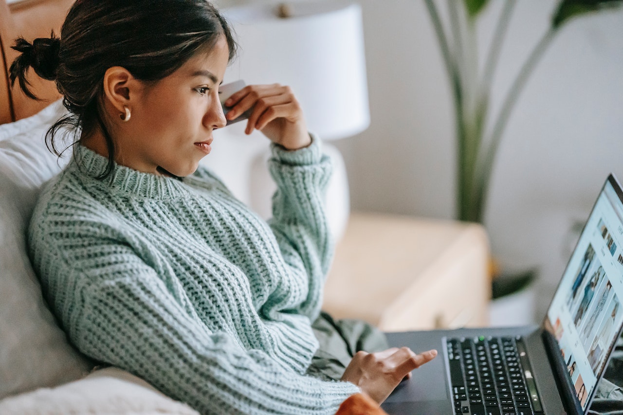 Woman signing up for a recurring payment subscription online